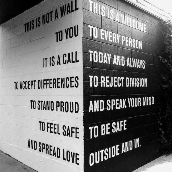 Truisms in black and white on a wall